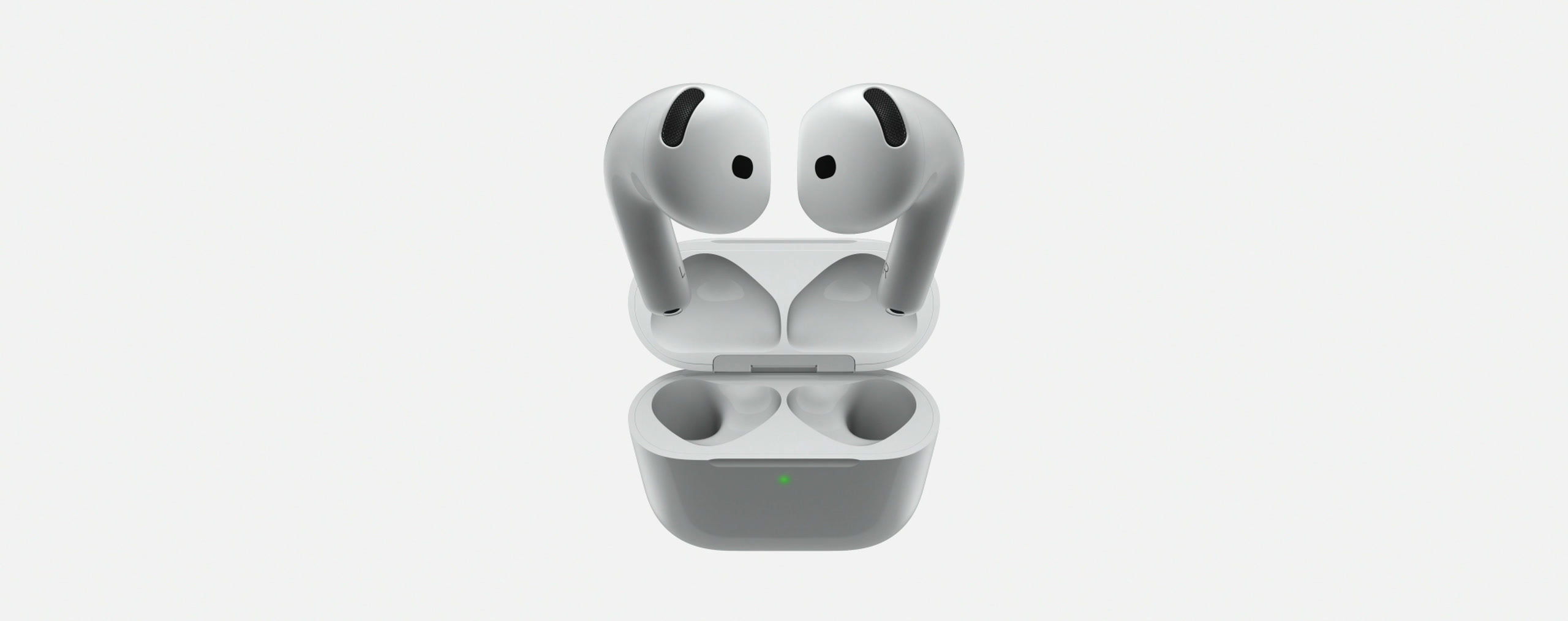 Los dos AirPods 5 suspendidos sobre su estuche de carga abierto